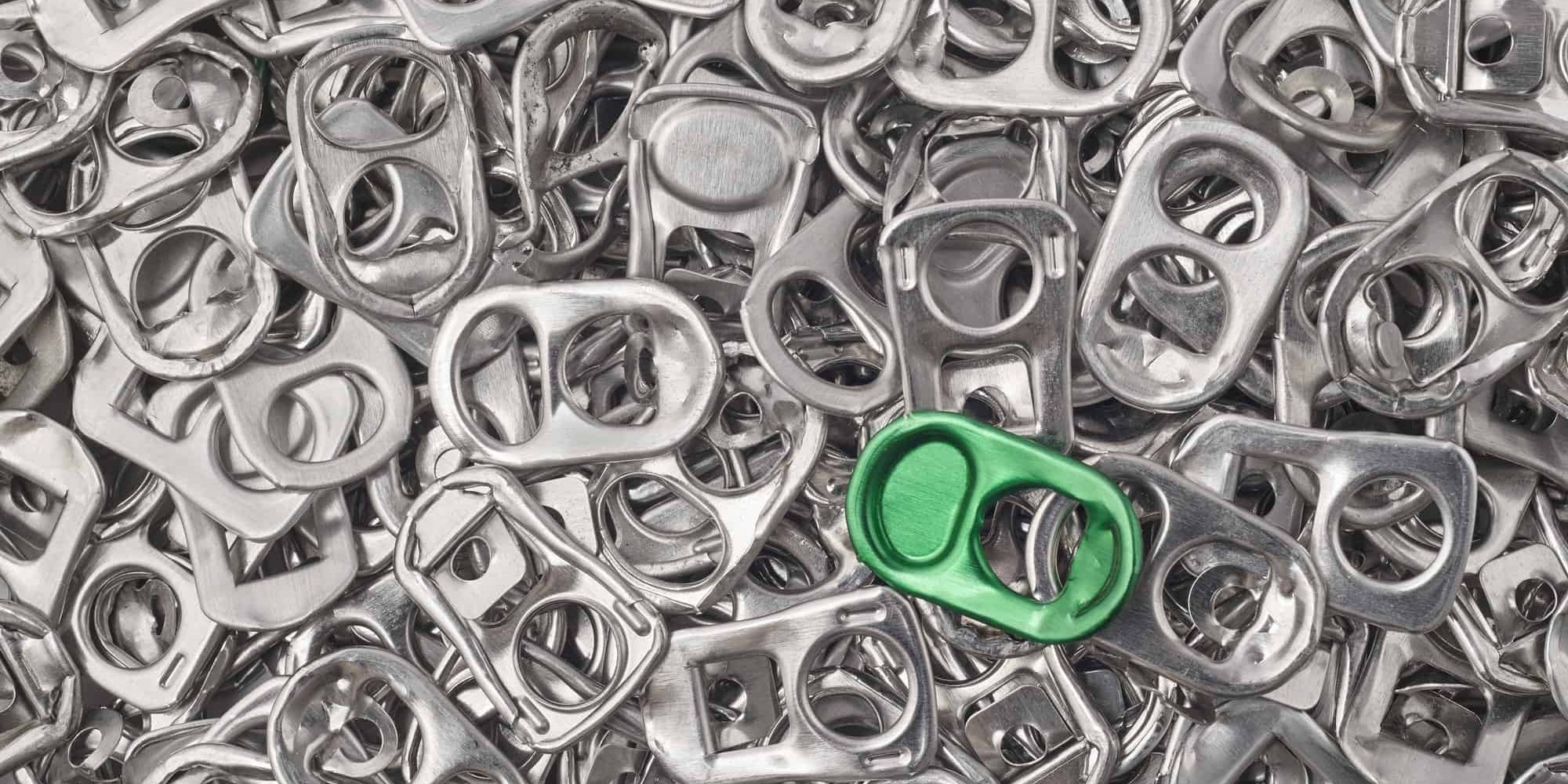 Recycling aluminum background with pull-tab pieces. Metallic waste. Horizontal Recycling aluminum background with pull-tab pieces. Metallic waste. Horizontal