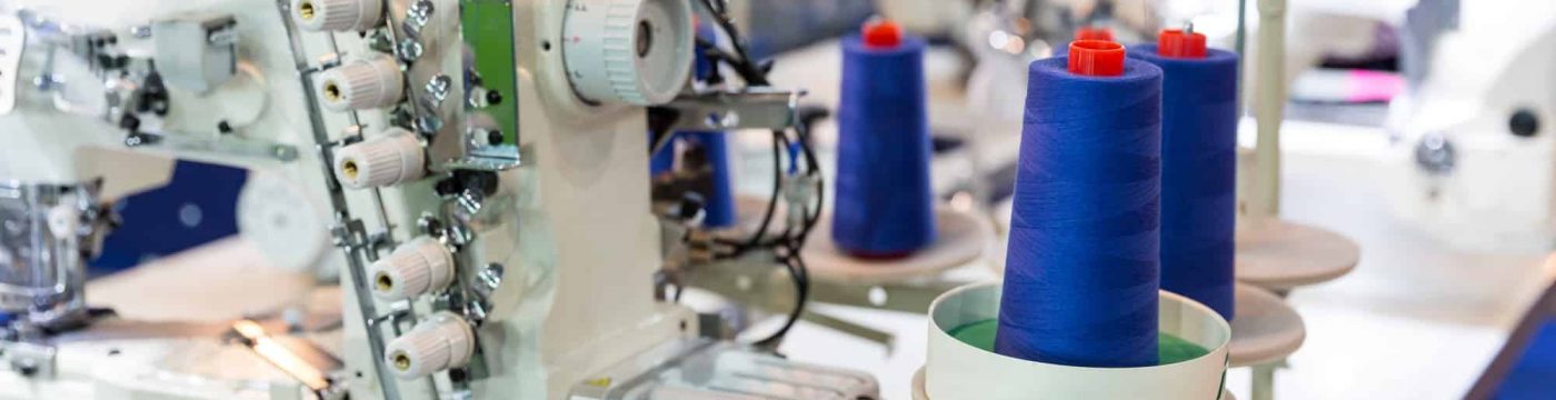 Sewing machine and cloth, nobody, clothing factory Sewing machine and cloth, nobody, clothing factory
